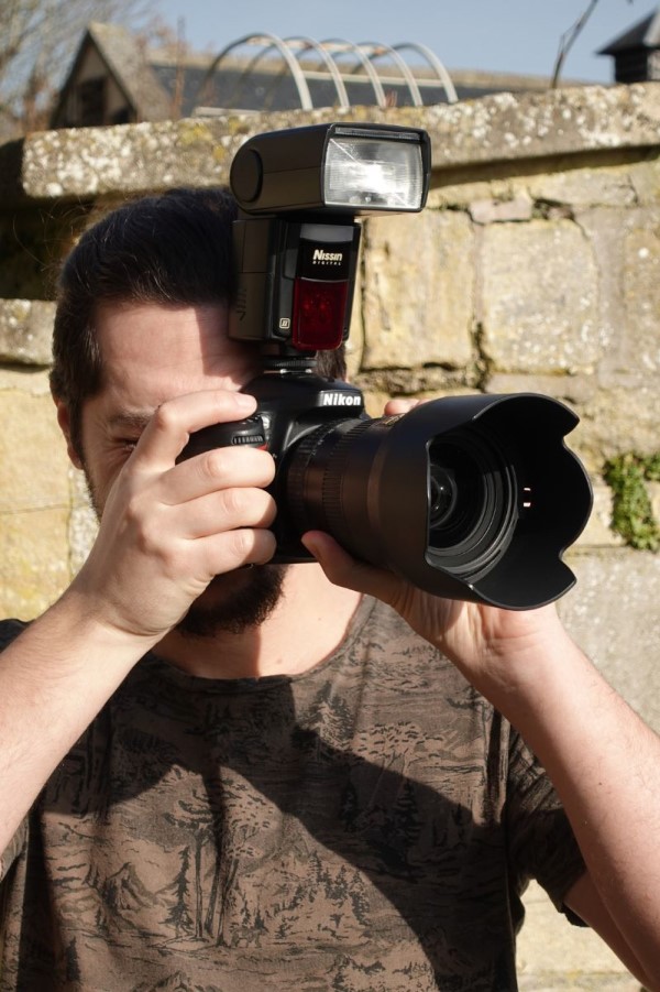 Young Male Using Nikon DSLR Camera